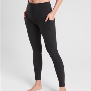 Athleta Black Stash Pocket Salutation Tights